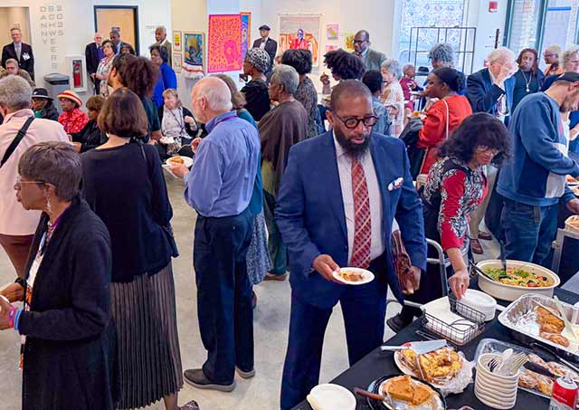 Photo of strangers, friends, and acquaintances at a coffee hour at the Chris White Gallery in Wilmington, Delaware.
