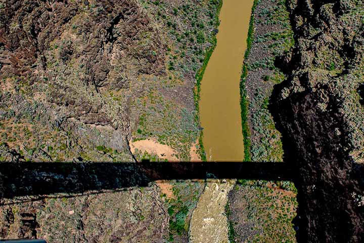 Photo of the shadow of the Rio Grande Gorge bridge northwest of Taos, New Mexico, copyright 2015 by Danny Nelson Schweers